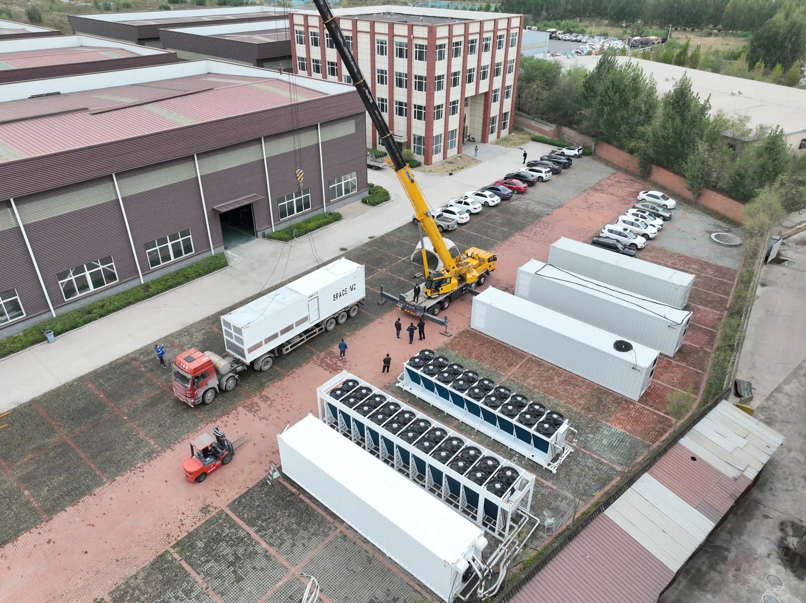 Aerial view of XINKE production base with container lifting operation