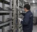 Technician inspecting hydro mining coolant pipes and gauges
